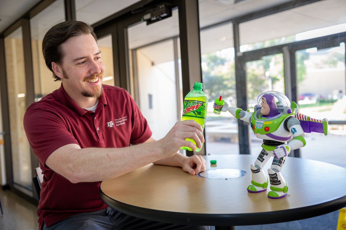 Garrett Crawford shares a Mountain Dew with Buzz Lightyear