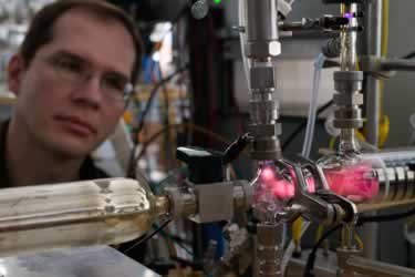 man staring deeply into lab equipment