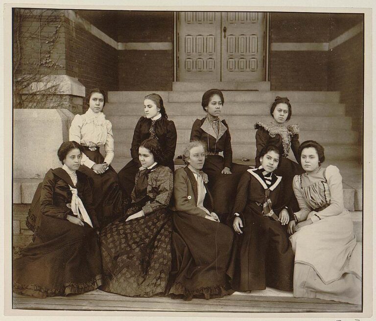 Nine African American women seated on the steps of a building at Atlanta University 1900