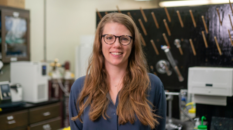 Texas A&amp;M chemist Emily Pentzer smiles for the camera within her laboratory in the Texas A&amp;M Chemistry Building