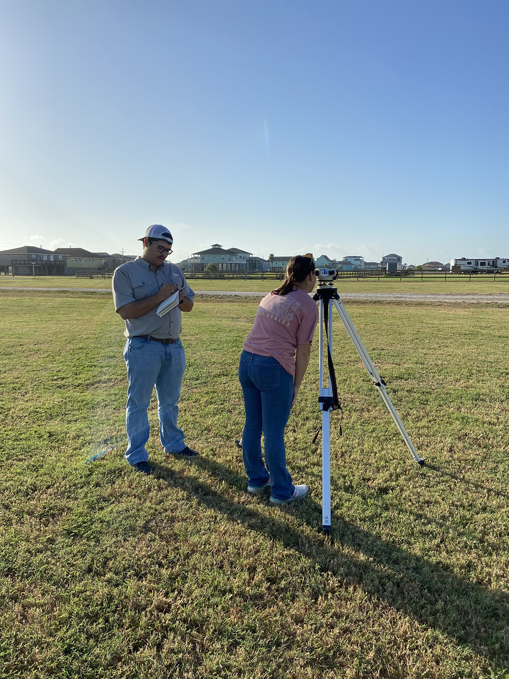 Texas A&amp;M University geography major Mackenzie Portie works on a level loop during filed work in summer 2023