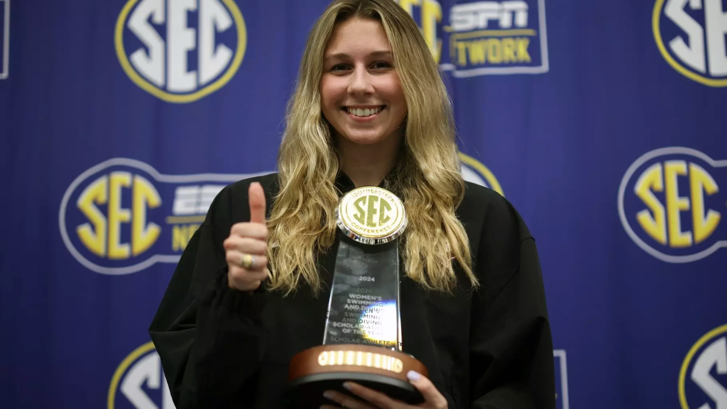 Texas A&amp;M University swimmer Chloe Stepanek poses with her trophy recognizing her as 2024 Southeastern Conference Women's Swimming &amp; Diving Scholar-Athlete of the Year