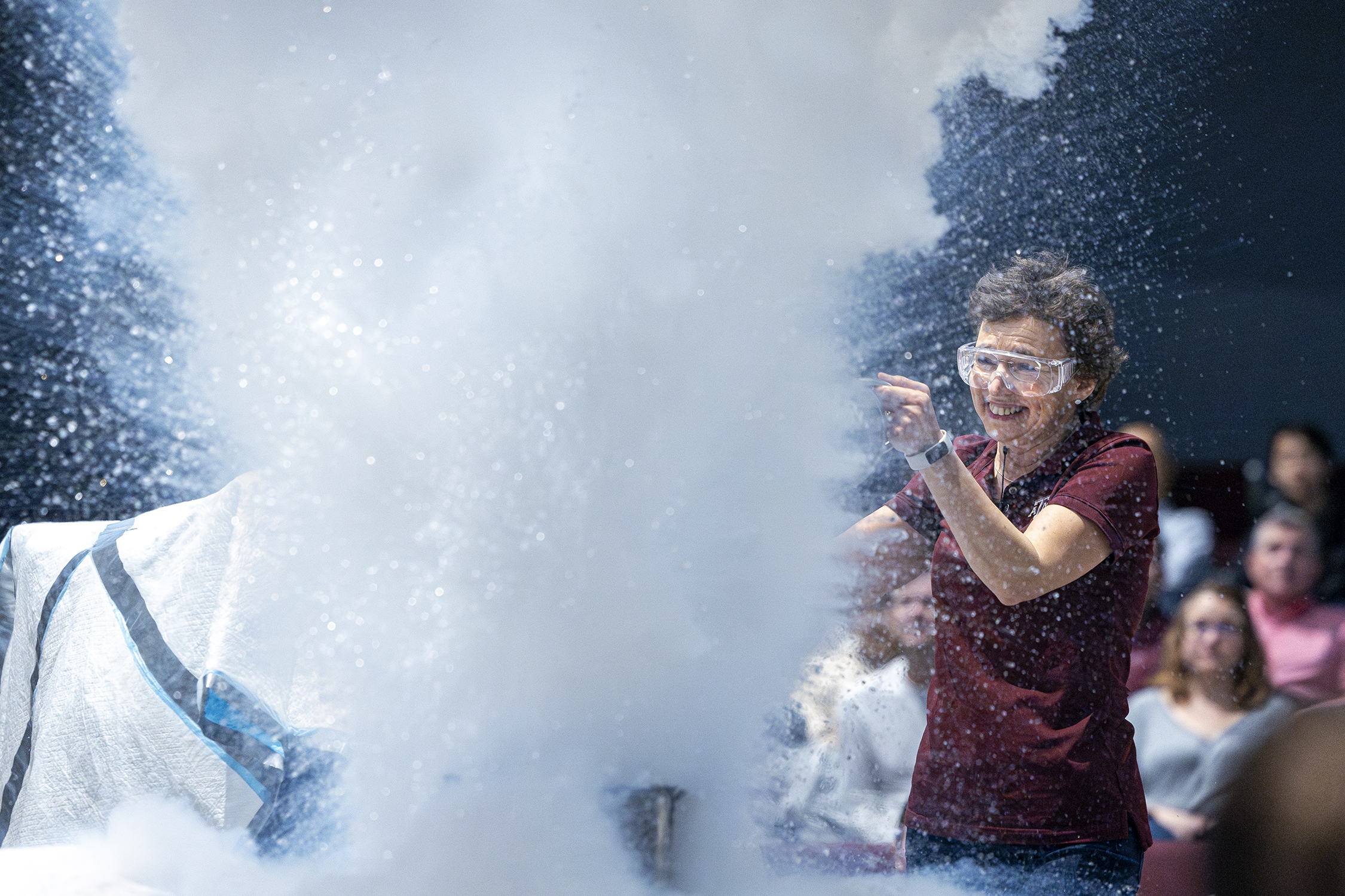 Texas A&amp;M physicist Tatiana Erukhimova is engulfed by a massive cloud of liquid nitrogen at Aggieland Saturday, held February 10, 2024, on the Texas A&amp;M campus