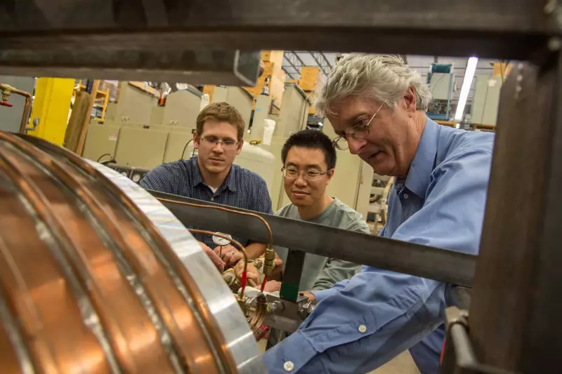 Peter McIntyre with students in lab